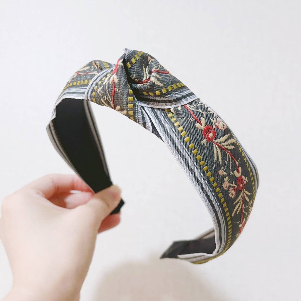 Gray knotted floral embroidery fabric headband