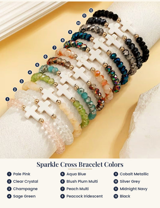 Sparkle cross bracelet color guide: 12 numbered bracelets labeled Pale Pink, Clear Crystal, Champagne, Sage Green, Aqua Blue, Blush Plum Multi, Peach Multi, Peacock Iridescent, Cobalt Metallic, Silver Grey, Midnight Navy, Black