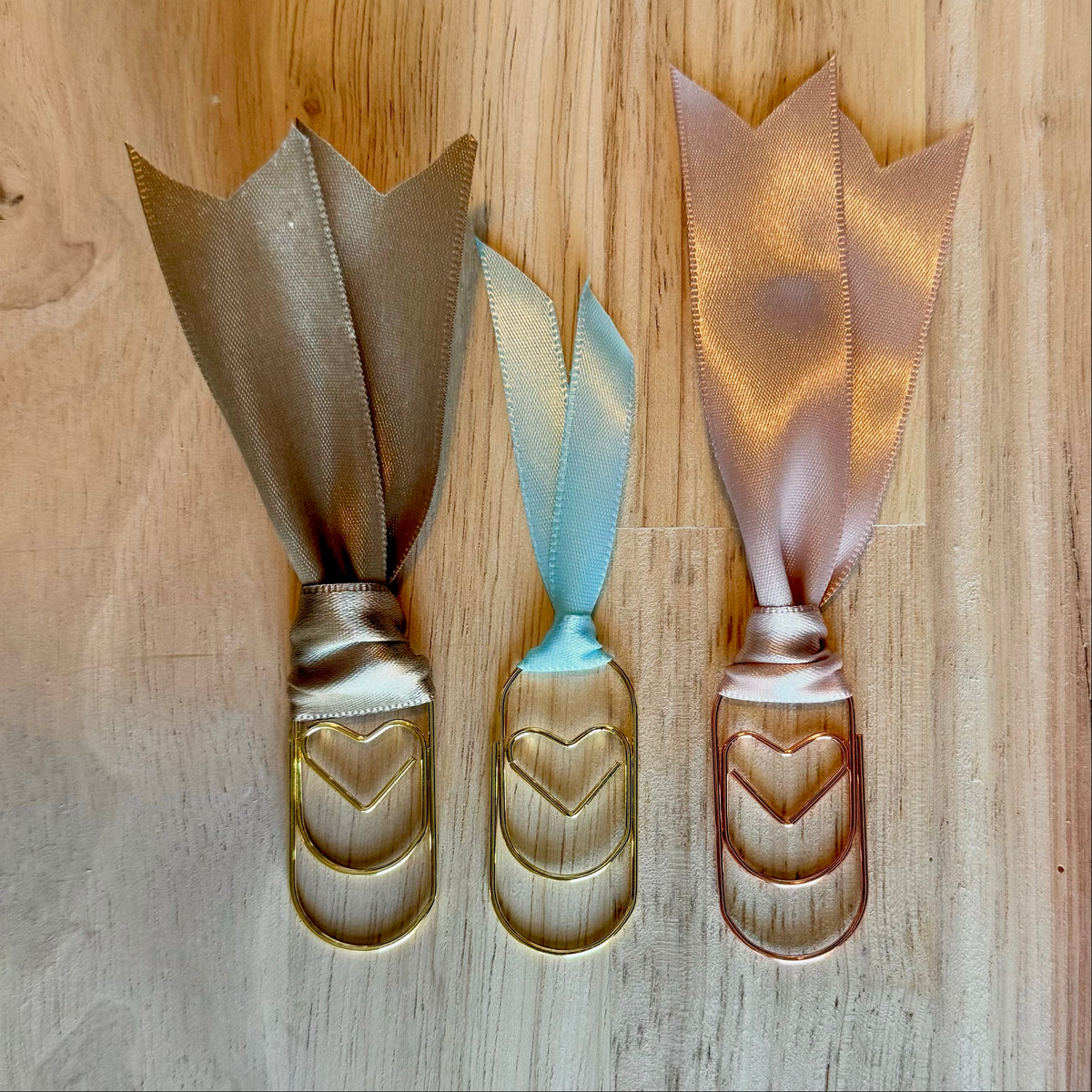Holiday Neutral example set of 3 ribbon paperclip bookmarks: tan satin, light blue and blush satin ribbons. Ribbons in your set will vary.
