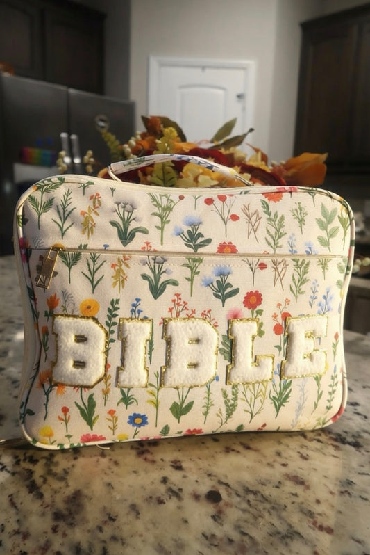 Wildflowers chenille zip Bible case with white BIBLE letters on a kitchen counter with fall flowers