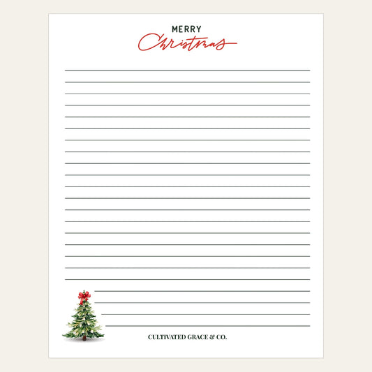 Merry Christmas Tree lined notepad with red script Merry Christmas and a small decorated tree