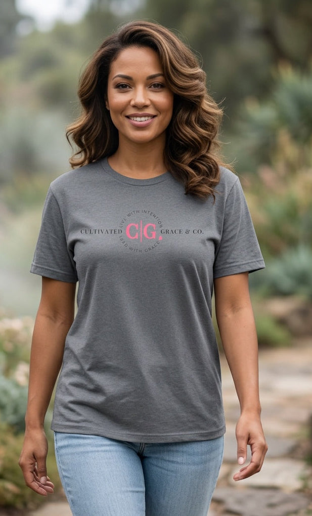 Cultivated Grace & Co. signature logo tee in graphite heather, garden setting