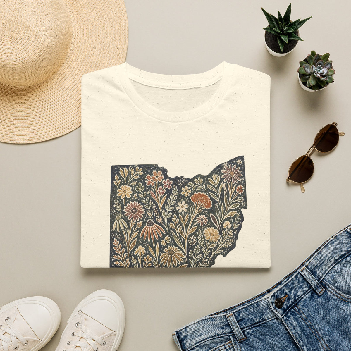 Floral Ohio Softstyle tee in Natural, folded flat lay with hat and denim