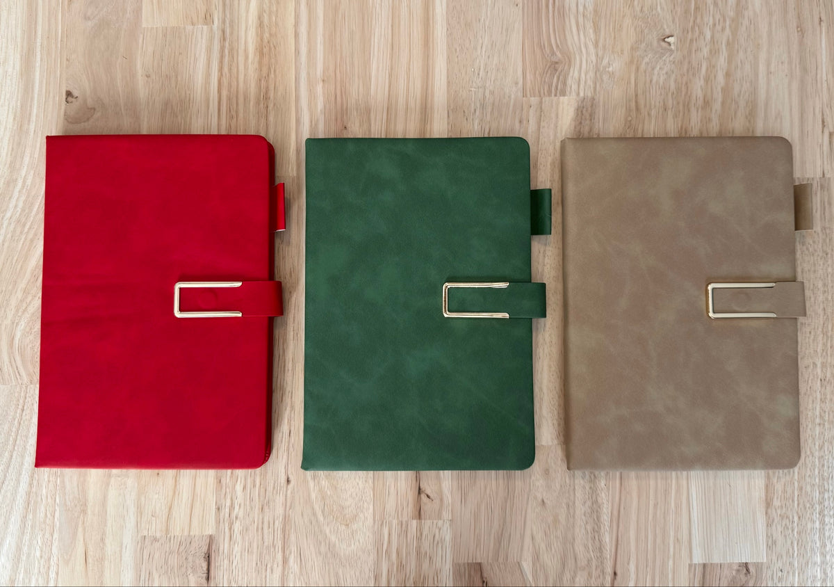 Main journal colors: Christmas Red, Evergreen and Holiday Neutral, each with gold trim and magnetic closure