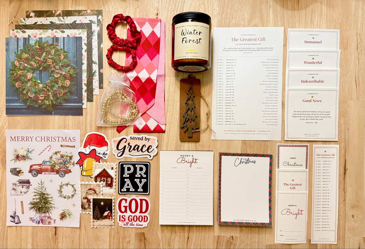 Studio pieces: reading plan card, scripture cards, notepads, gift tags and bookmark, shown with the candle, ornament, stickers and journaling papers