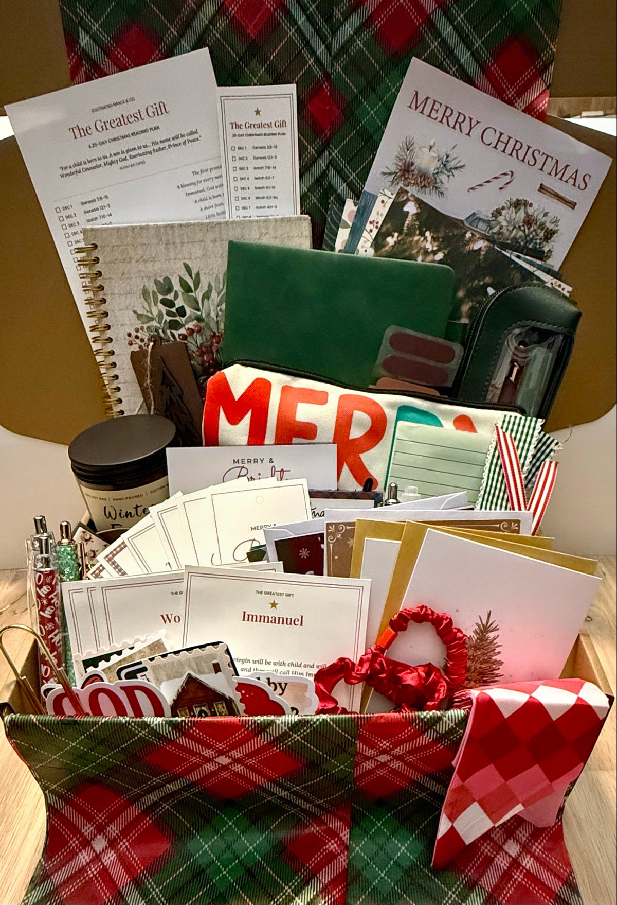 The Greatest Gift Christmas Box packed in a kraft gift box with plaid wrap