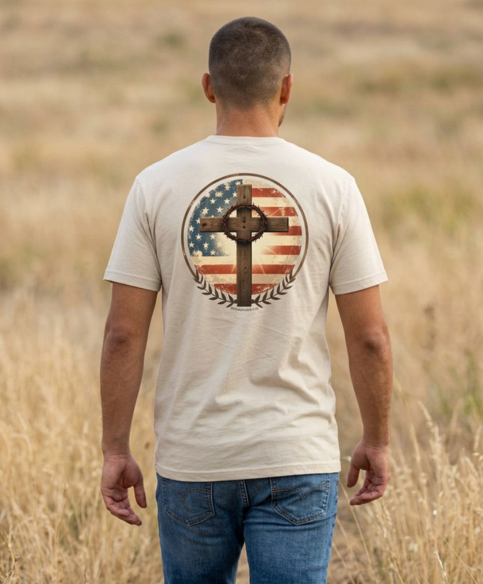 Man wearing the Distressed Flag and Cross tee in Sand, back view