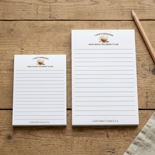 Both espresso notepad sizes on a rustic wood table