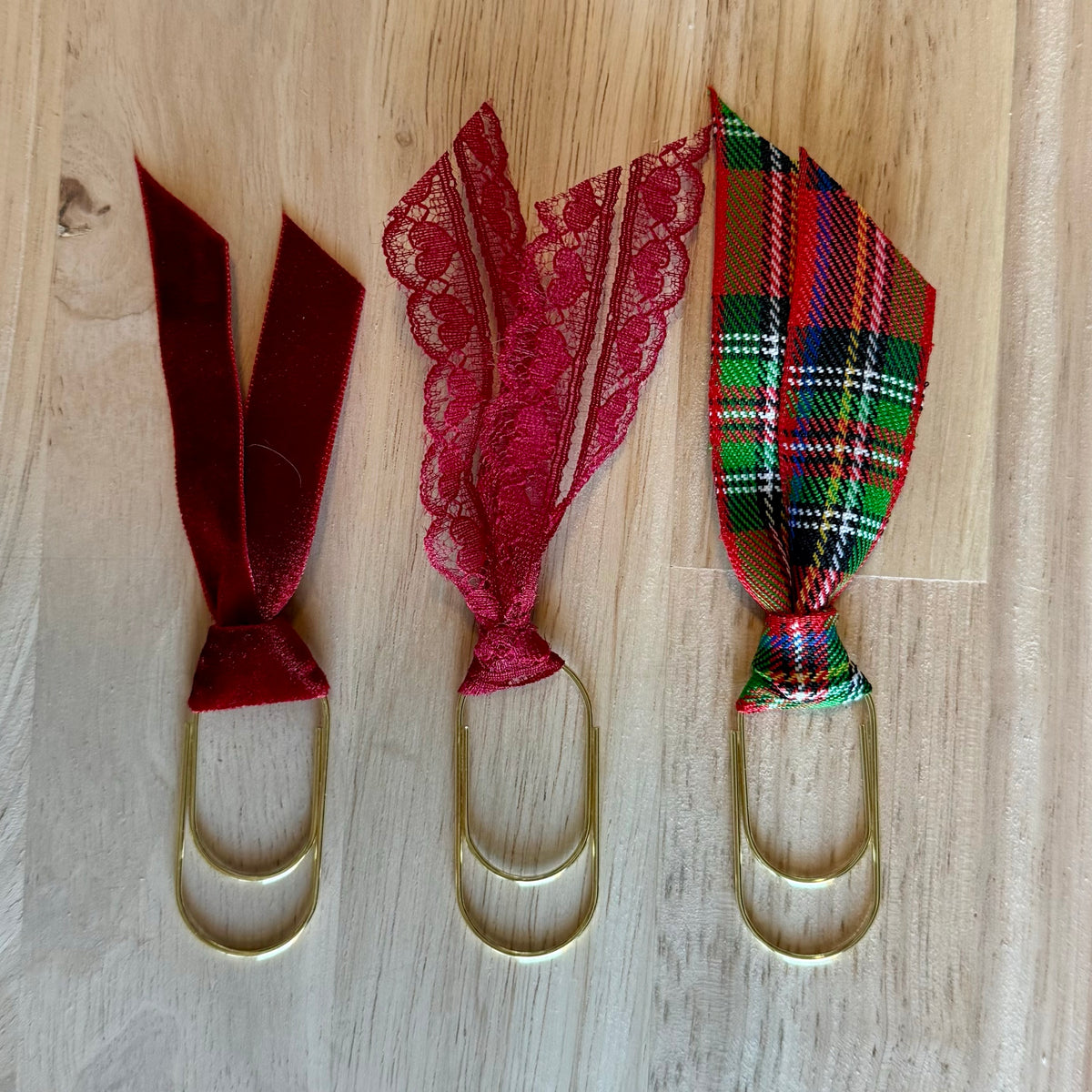 Christmas Red example set of 3 ribbon paperclip bookmarks: burgundy, red lace and red plaid ribbons. Ribbons in your set will vary.