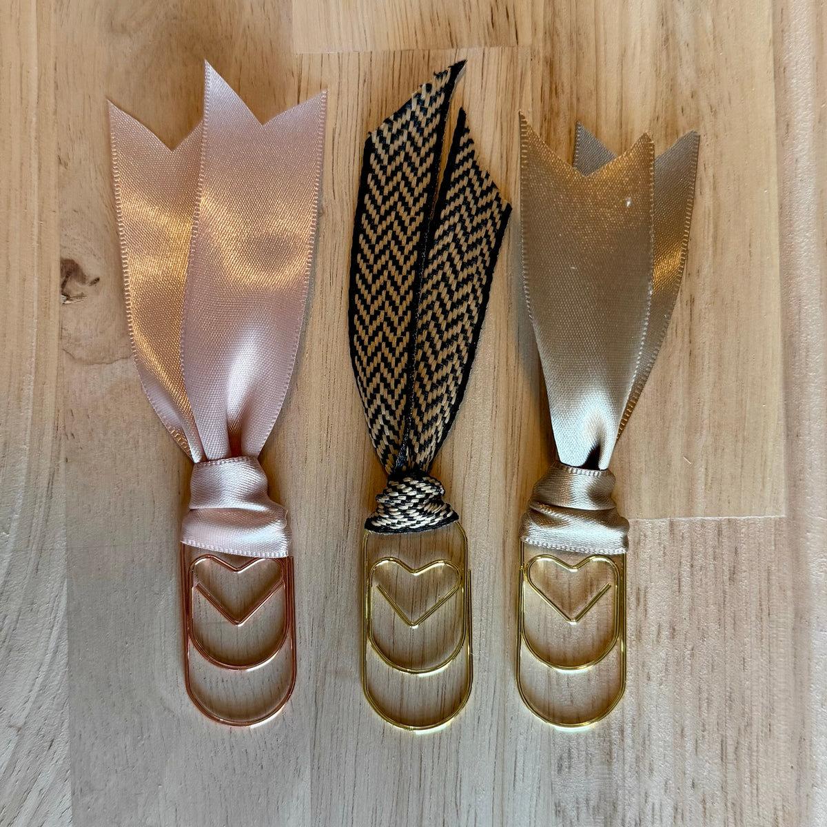 Holiday Neutral example set of 3 ribbon paperclip bookmarks: blush satin, black-and-cream herringbone and champagne satin ribbons. Ribbons in your set will vary.