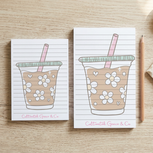 Daisy Iced Coffee notepads in both sizes on a rustic wood table
