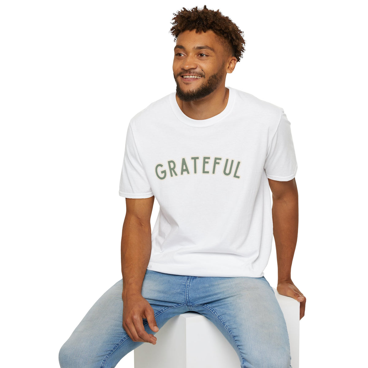 Grateful Softstyle T-Shirt in White, sage green arched GRATEFUL lettering with cream outline, worn by a man