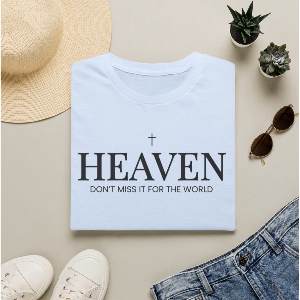 Heaven Don't Miss It for the World tee in Light Blue, folded flat lay
