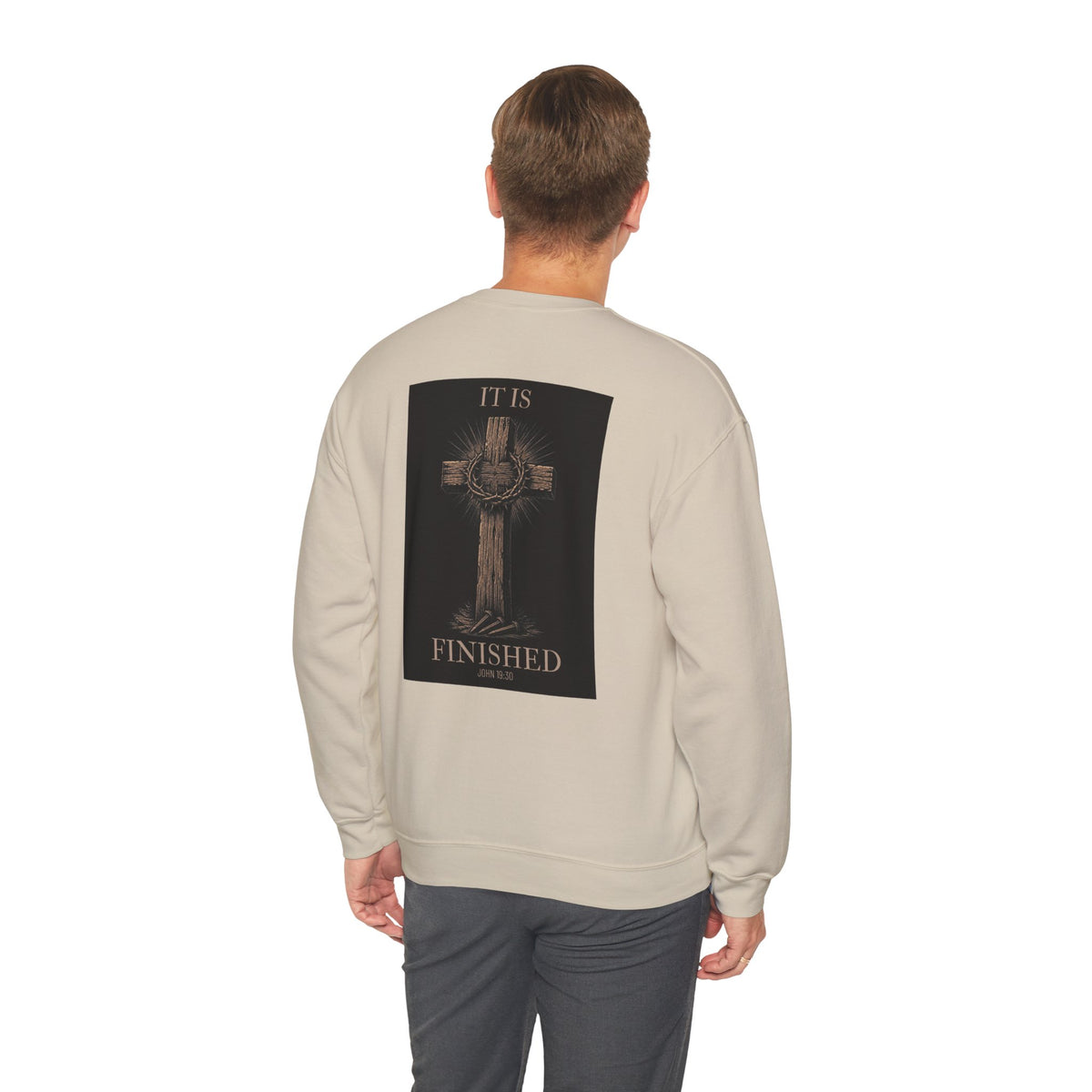 Man wearing the It Is Finished crewneck sweatshirt in Sand, back view