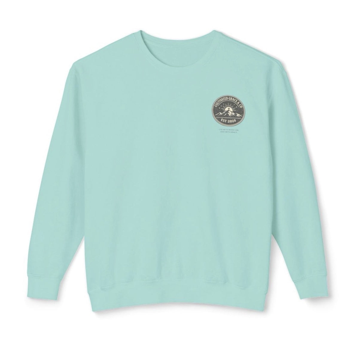 Cultivated Grace & Co. mountains and cross crewneck sweatshirt in Chalky Mint, front with left-chest badge