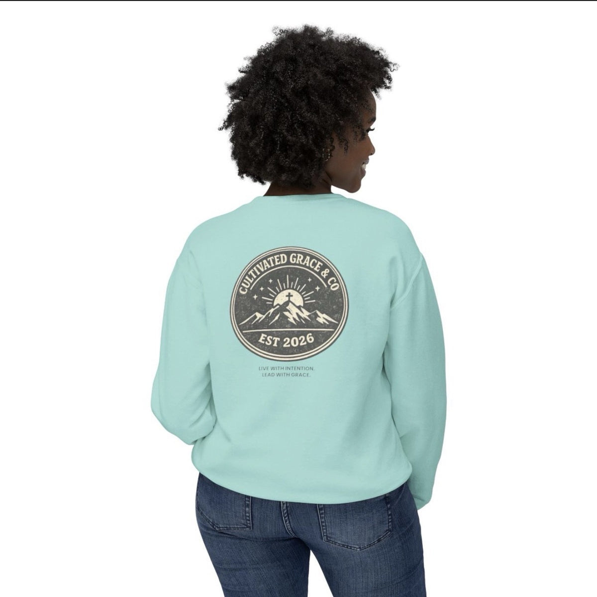 Cultivated Grace & Co. mountains and cross crewneck sweatshirt in Chalky Mint, worn, back view