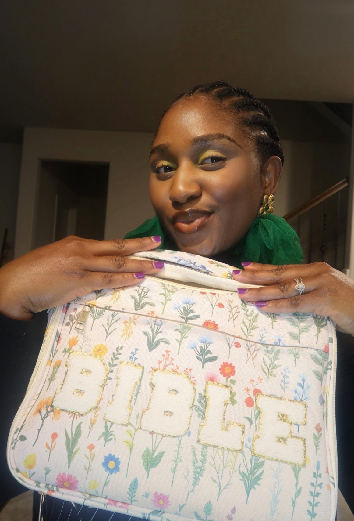 Natalie smiling with the Wildflowers chenille zip Bible case held at her chest