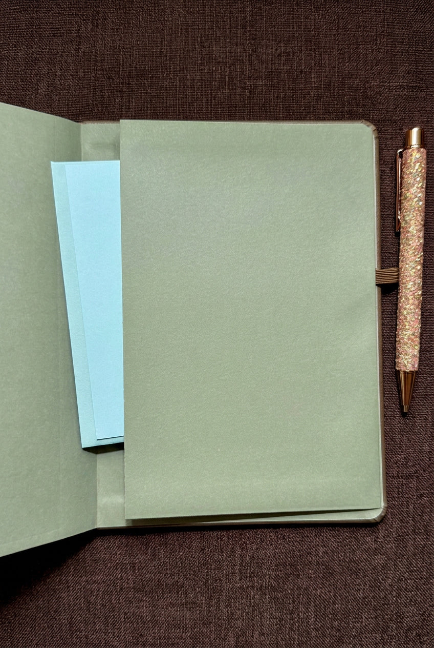 Pocket inside the back cover of the deluxe print style faith word journal, holding an envelope